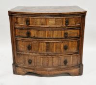 Early 19th century bow-fronted elm and elm veneered chest of drawers, the top with patterned veneers