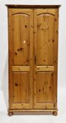 Modern pine wardrobe with double panel doors, on ball feet, 190cm high x 92cm wide x 55cm deep