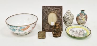 Two Chinese porcelain relief moulded snuff bottles, early 20th century, moulded with figures and