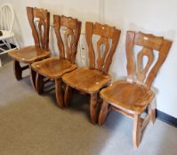 Set of four mid-century continental oak Brutalist Tiroler type dining chairs with shaped backs,