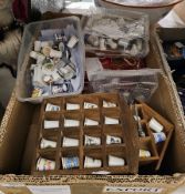 Quantity of vintage ceramic and metal thimbles depicting various scenes including animals and