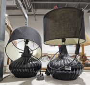Pair of contemporary black glazed table lamps of bulbous form, with shades, 25cm high excluding