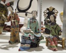 Three Chinese porcelain glazed figures of women, two seated, one standing (3)