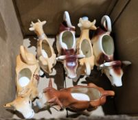Six cow creamers, three bearing Jersey decoration, one Guernsey, to include a West German example (