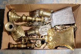 Assorted brassware including a pair of candlesticks of stepped baluster form, a brass coal shovel, a