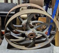 Pair of vintage cast iron wheels, 75.5cm diameter made in two parts, possibly belt drive wheels from