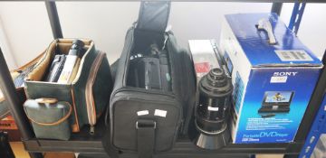 Sony Handycam video camera recorders, another video camera, a Sony portable DVD player and a Rank