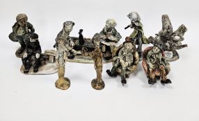Collection of pottery figures by Norman Underhill, including two figures seated in armchairs, figure