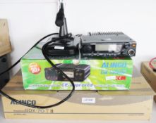 Alinco DX-70 HF transceiver, a DR-M06 model, an Alinco DM-330 MW power supply and an EMS-14 desk top