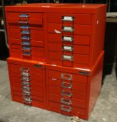 Two red metal five-drawer Bisley table top cabinets and two similar Bisley eight-drawer table top