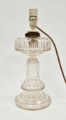 Early 20th century cut glass table lamp, with stepped lens-cut upper tier, honeycomb stem and lens-