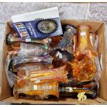 Box of carnival glass in purple and orange tints, predominantly flared, flower vases and a field