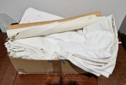 Box of white table linen, early to mid-20th century, two rolls of vintage wallpaper, one handblocked
