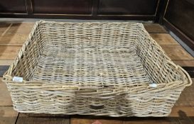 Large wicker basket, possibly a dog bed