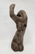 Naive wooden carving of kneeling female nude, looking behind with one hand raised, 72cm high