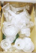 Two boxes of press moulded clear and coloured glass including Royal commemoratives, candlesticks,