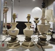 Pair of Laura Ashley cream ground urn form table lamps and another similar (3)