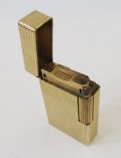 St Dupont of Paris gold-plated lighter with chequered decoration, serial no. stamped to base P70J62,