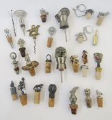Quantity of novelty bottle stoppers including one in the form of a knight's helmet, another claret