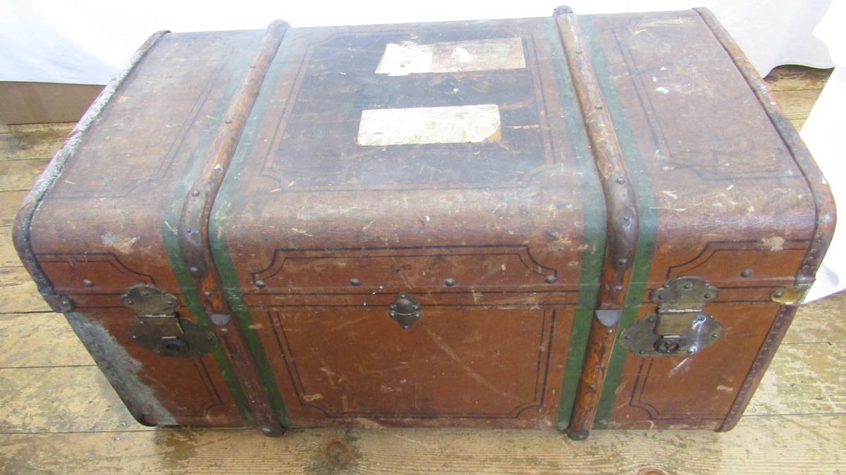 A mid 20th century canvas and wood bound trunk