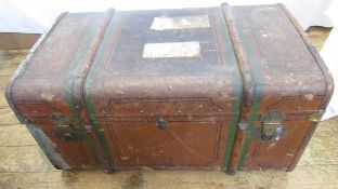 A mid 20th century canvas and wood bound trunk