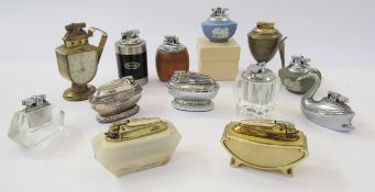 Quantity of vintage table lighters including a Swiza eight-day table lighter clock, a Ronson Libri