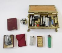 Quantity of vintage pocket lighters including Ronson Varaflame, Trench Art style brass lighters, and
