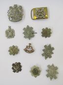 Collection of nine Scottish military cap badges, belt buckle and shoulder title.