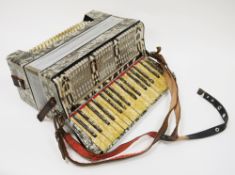 Cased Stanelli piano accordion by Meinel and Herold, having  a grey pearlescent finish, 45cm wide