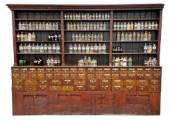 Large Victorian mahogany apothecary shop cabinet, the moulded cornice over an upper part of three