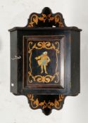 19th century ebonised hanging corner cabinet with shaped galleried top rail and bottom rail,