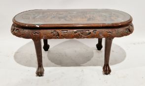 Chinese hardwood coffee table with rounded ends, the top with carved relief decoration of sailing