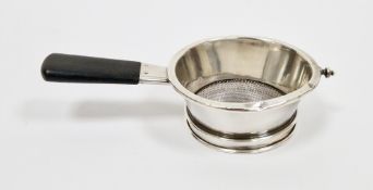 American sterling silver tea strainer, of plain circular form with an ebony handle, stamped to