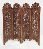 Anglo-Indian hardwood four-fold dressing screen, each panel with pierced and blind fretwork carved
