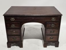 19th century mahogany desk, the rectangular top with moulded edge, over an arrangement of seven