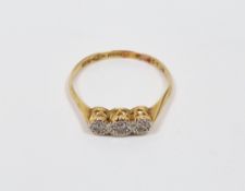 18ct yellow gold, platinum and diamond ring, having a row of three illusion set old cut round