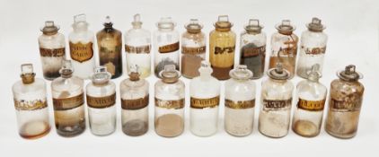 Twenty late 19th/early 20th century labelled glass apothecary bottles and stoppers, each of