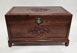 Chinese camphorwood blanket box, the hinged lid and front panel having a central relief carved