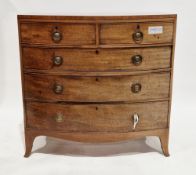 Early 19th century mahogany and ebony inlaid bowfront chest comprising two short and three long