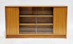 Mid-century retro Herbert Gibbs Furniture teak library bookcase comprising a pair of central sliding