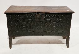 17th century oak six-plank coffer, the rectangular top with thumbmould edge over a later carved