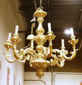 Carved wooden six-branch electrolier having a distressed cream finish with carved acanthus leaf