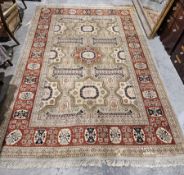 20th century Turkish Anatolian wool rug, the central field decorated with star-shaped rosettes and