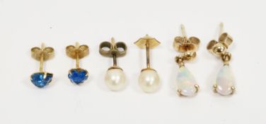 Pair of 9ct yellow gold and white opal drop earrings, each earring set with a pear shaped cabochon