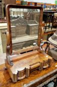 Victorian walnut swing dressing mirror, the rectangular plate held on scrolling carved supports