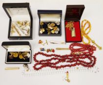 Collection of cufflinks, dress studs, tie slides, badges and costume jewellery necklaces and a cased