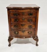 Walnut chest of serpentine outline in the George III manner, the crossbanded top with ogee moulded