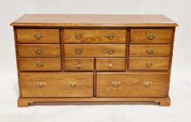 Younger Furniture hardwood long chest, the rectangular top with moulded edge over an arrangement
