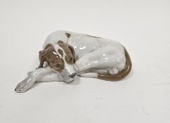 Royal Copenhagen porcelain model of a recumbent pointer, modelled by Lauritz Jensen, incised L.J. to