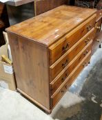 Modern stained pine chest of four long drawers with metal swan neck loop handles, on bun feet,